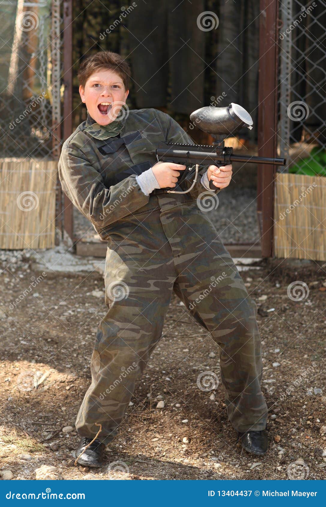 Boy with paintball gun stock image. Image of sport, uniform 13404437