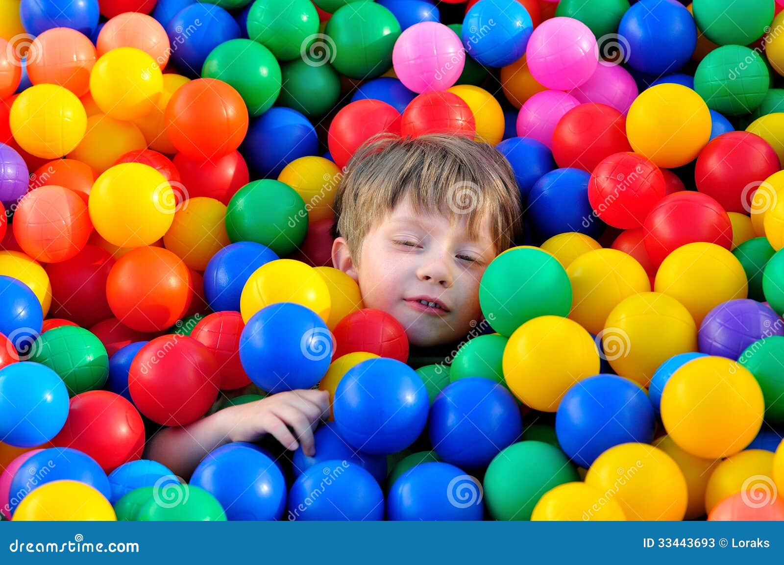 Boy playing with balls. stock image. Image of little 33443693