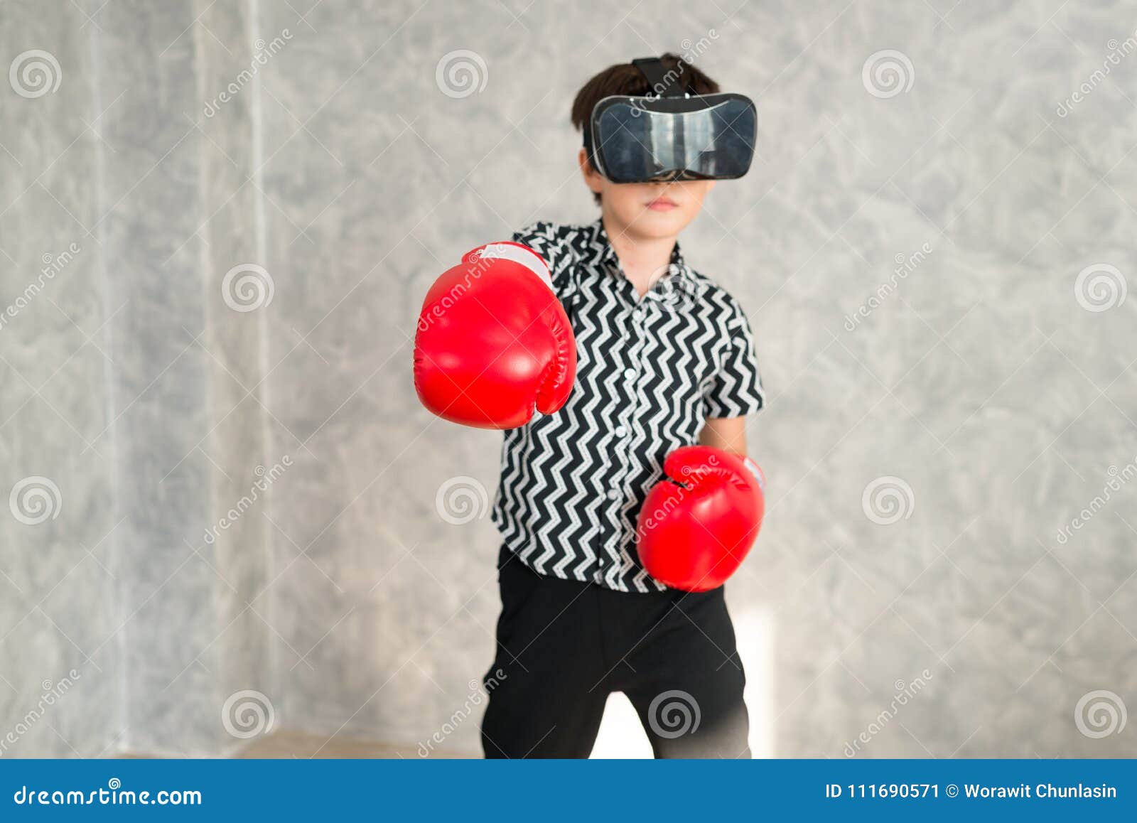 A Boy is Playing Boxing Game with 3D Virtual Reality Headset. Stock Image Image of gloves