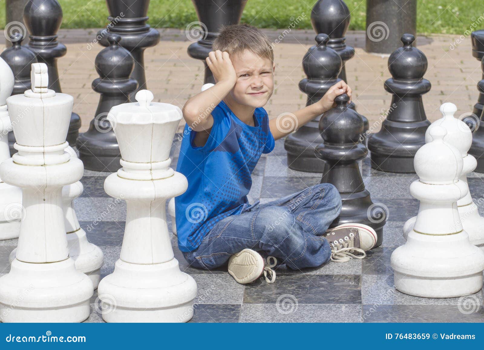 Handsome Male Model Considers His Next Chess Move Stock Photo