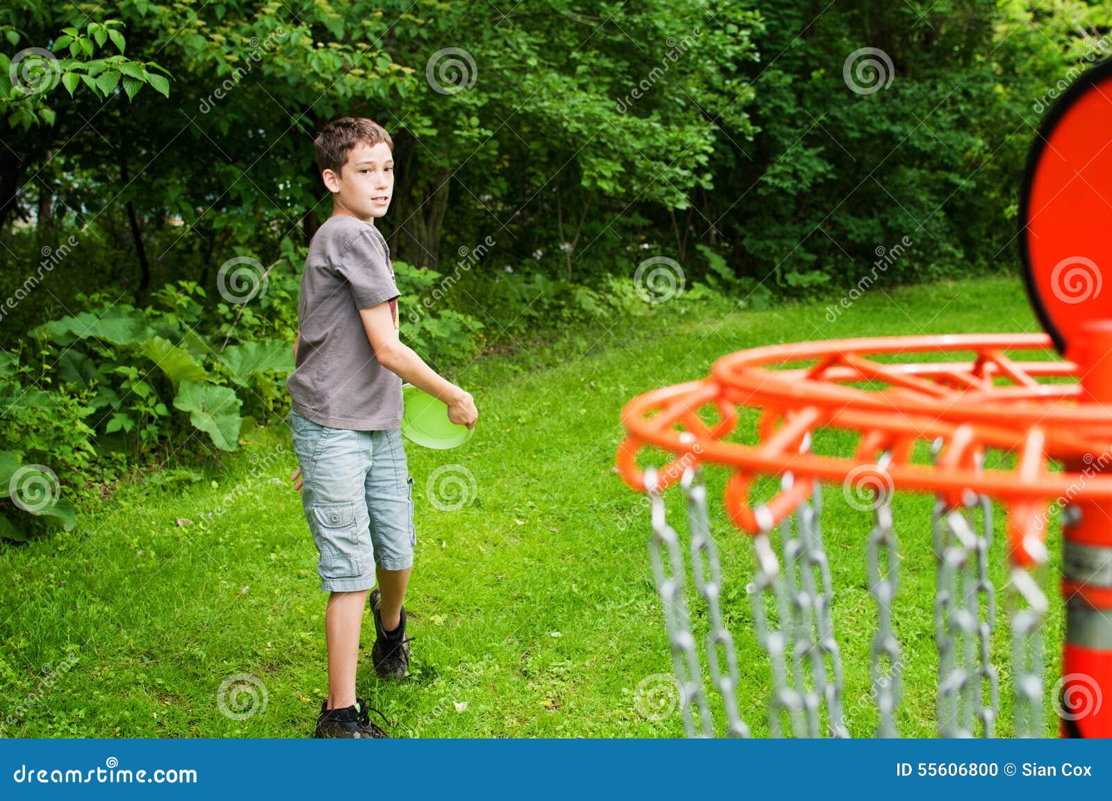 Boy playing disc golf stock photo. Image of park, active 55606800