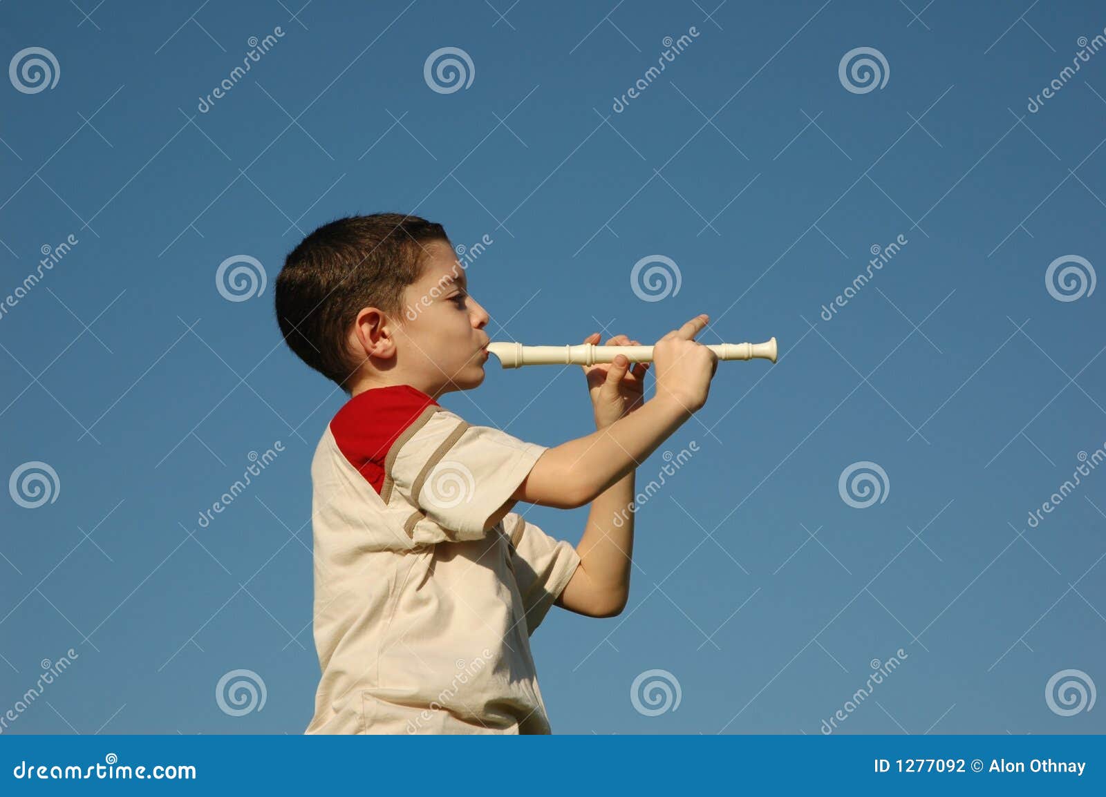 Boy playing the flute stock photo. Image of adolescent 1277092