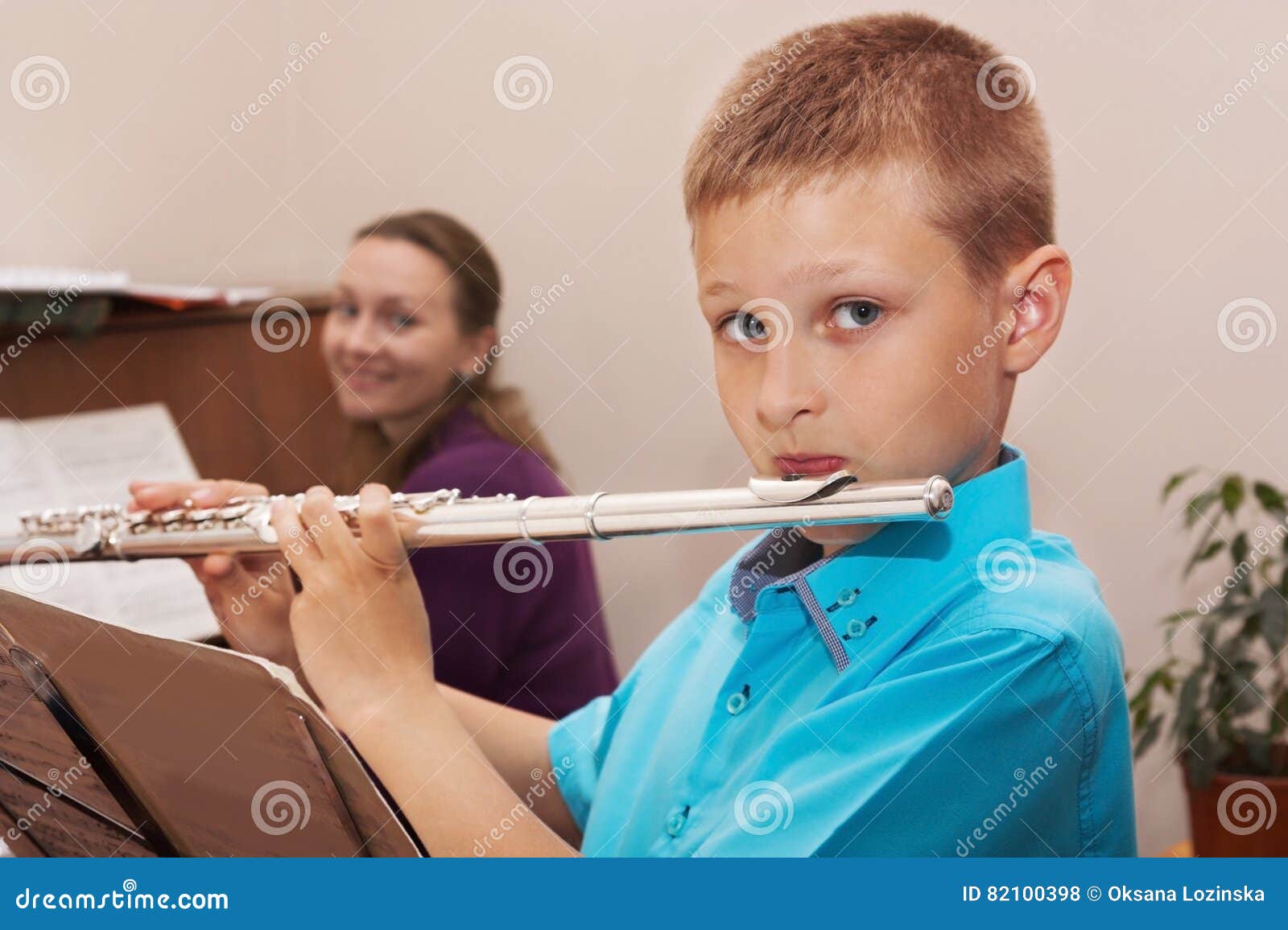 Boy playing the flute stock photo. Image of concert, flute 82100398