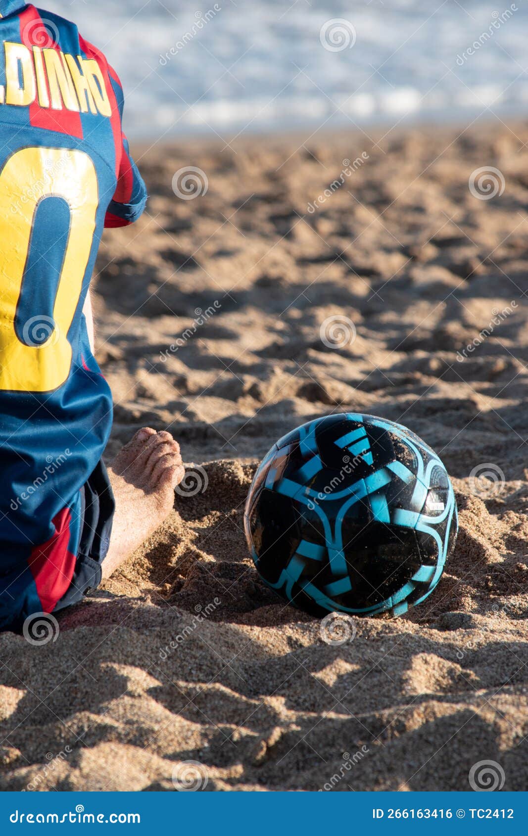 Boy Playing Football in the Beach Stock Photo Image of beach, blue