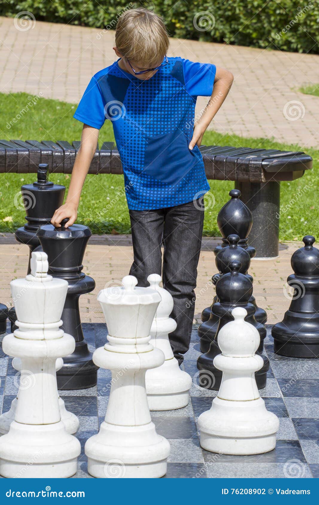 Children's Restraining Hand Thoughtfully Figure Before The Next Chess Move  Stock Photo, Picture and Royalty Free Image. Image 77247675.