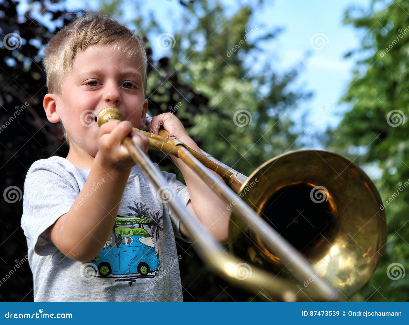 Boy Playing the Golden Trombone Outdoors Stock Image Image of summer
