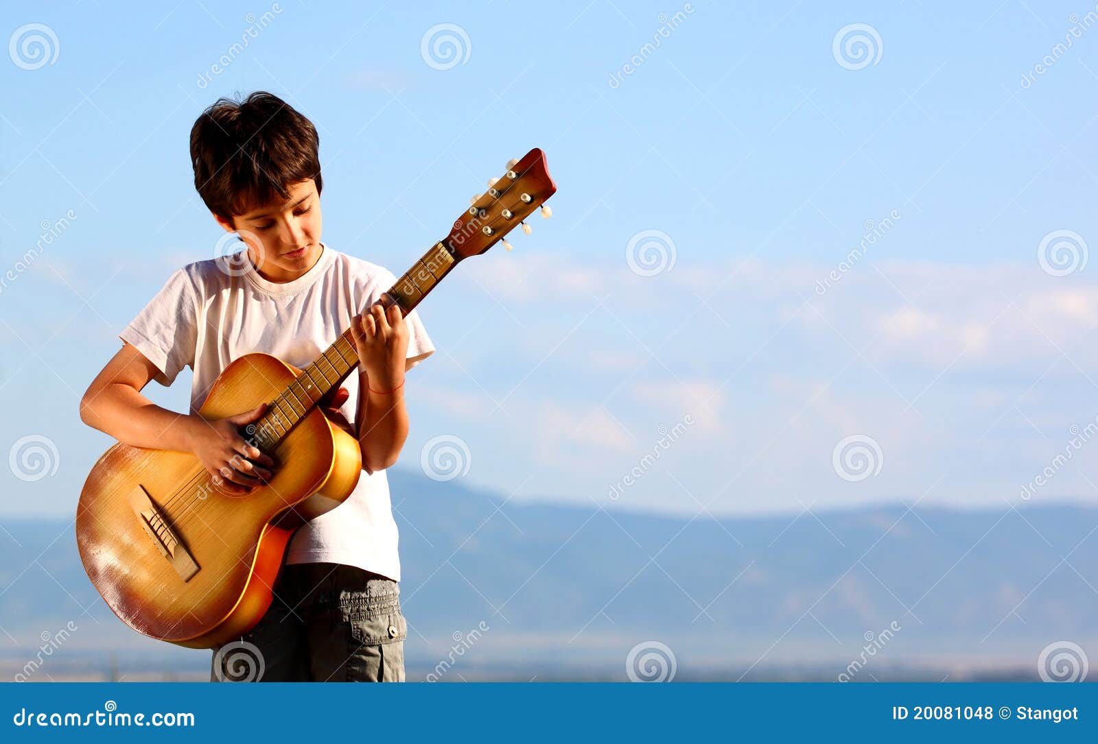 Boy playing guitar stock photo. Image of objects, hold 20081048