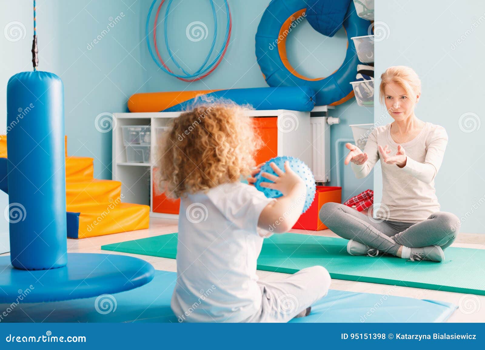 boy playing with his therapist