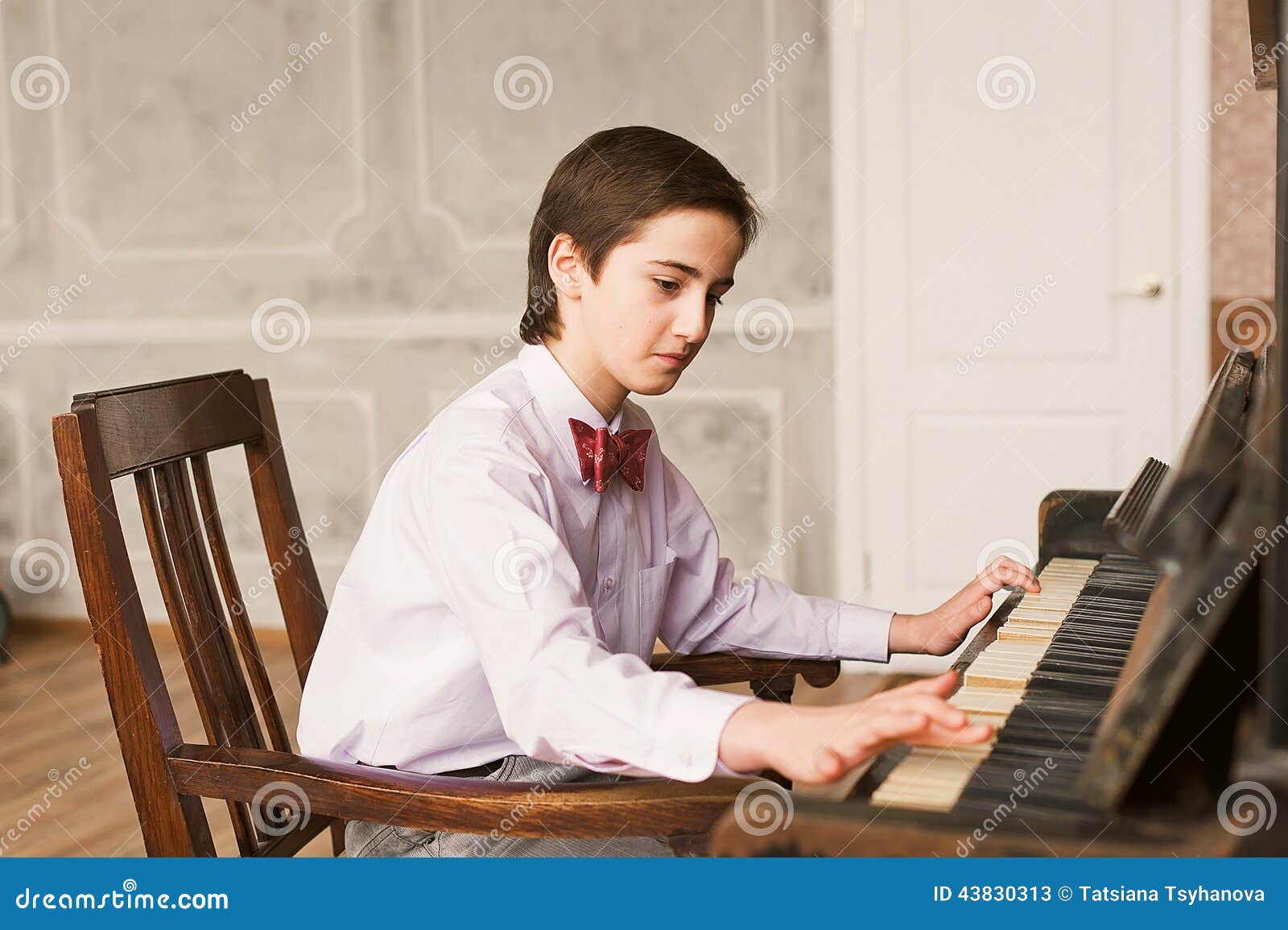 Boy Playing Piano stock image. Image of person, room - 43830313