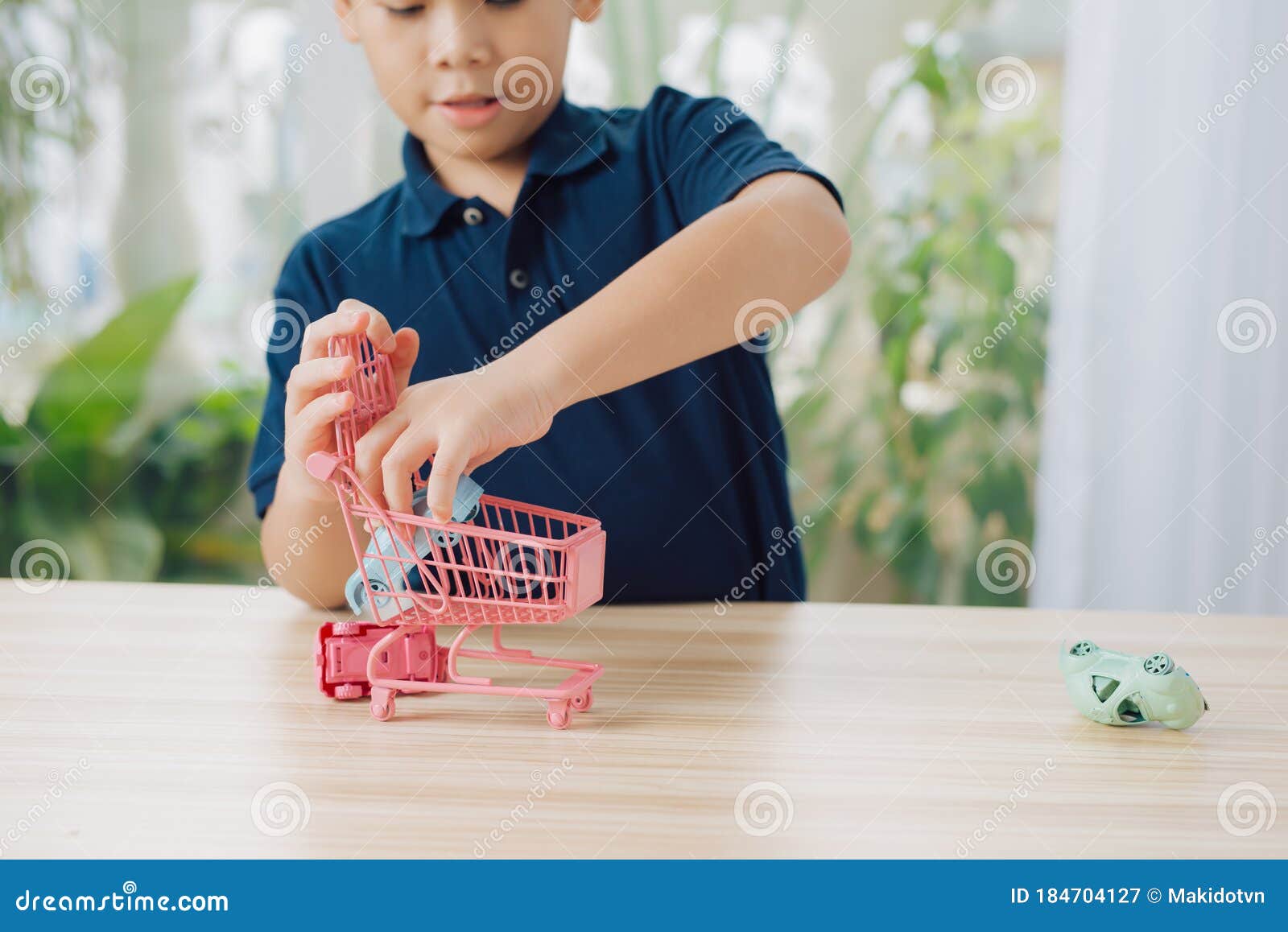 Boy Playing Toy Cars on Table Stock Image Image of little, home
