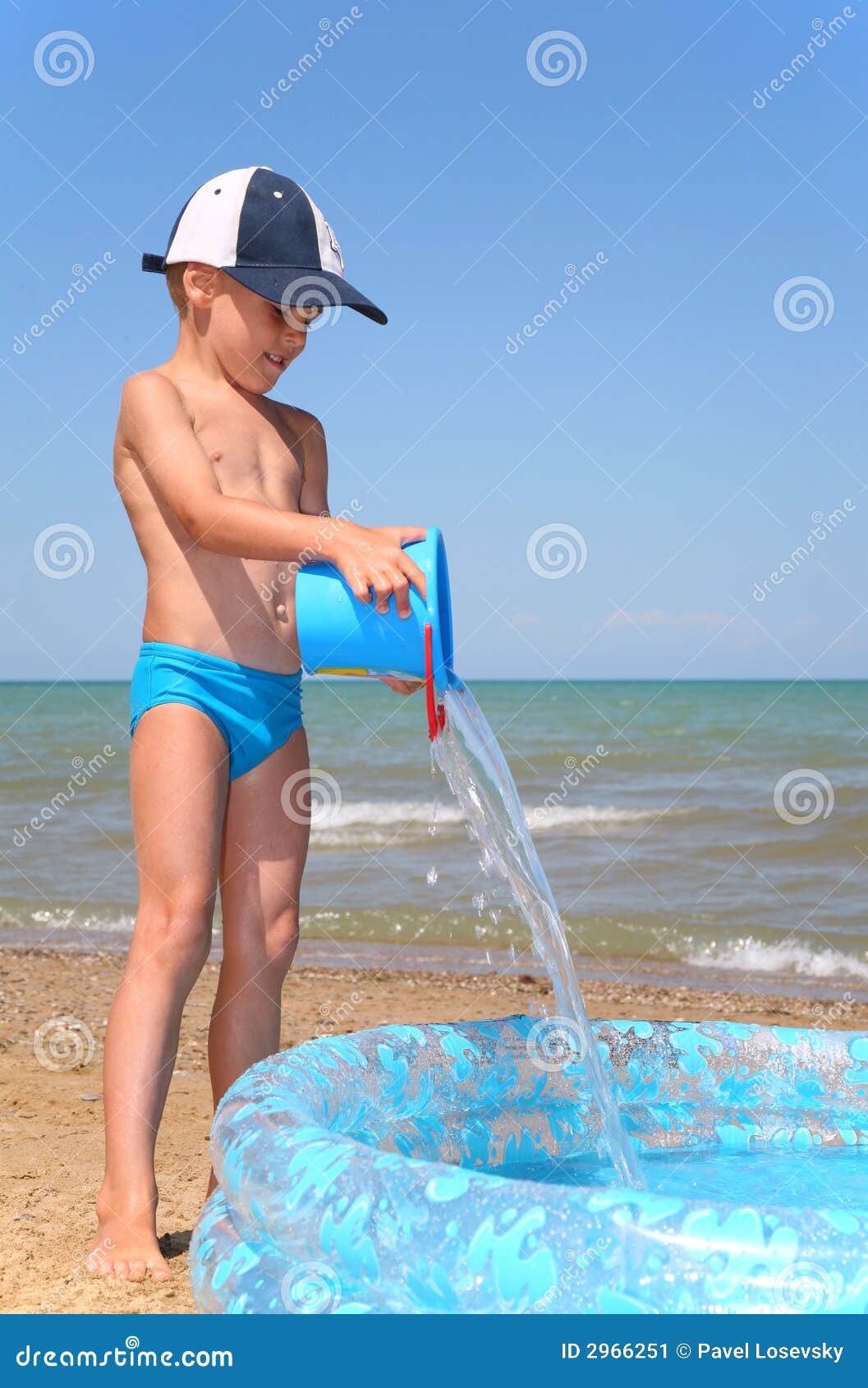 boy plays on a beach