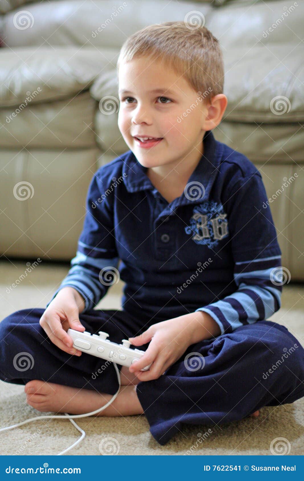 boy plays handheld video game