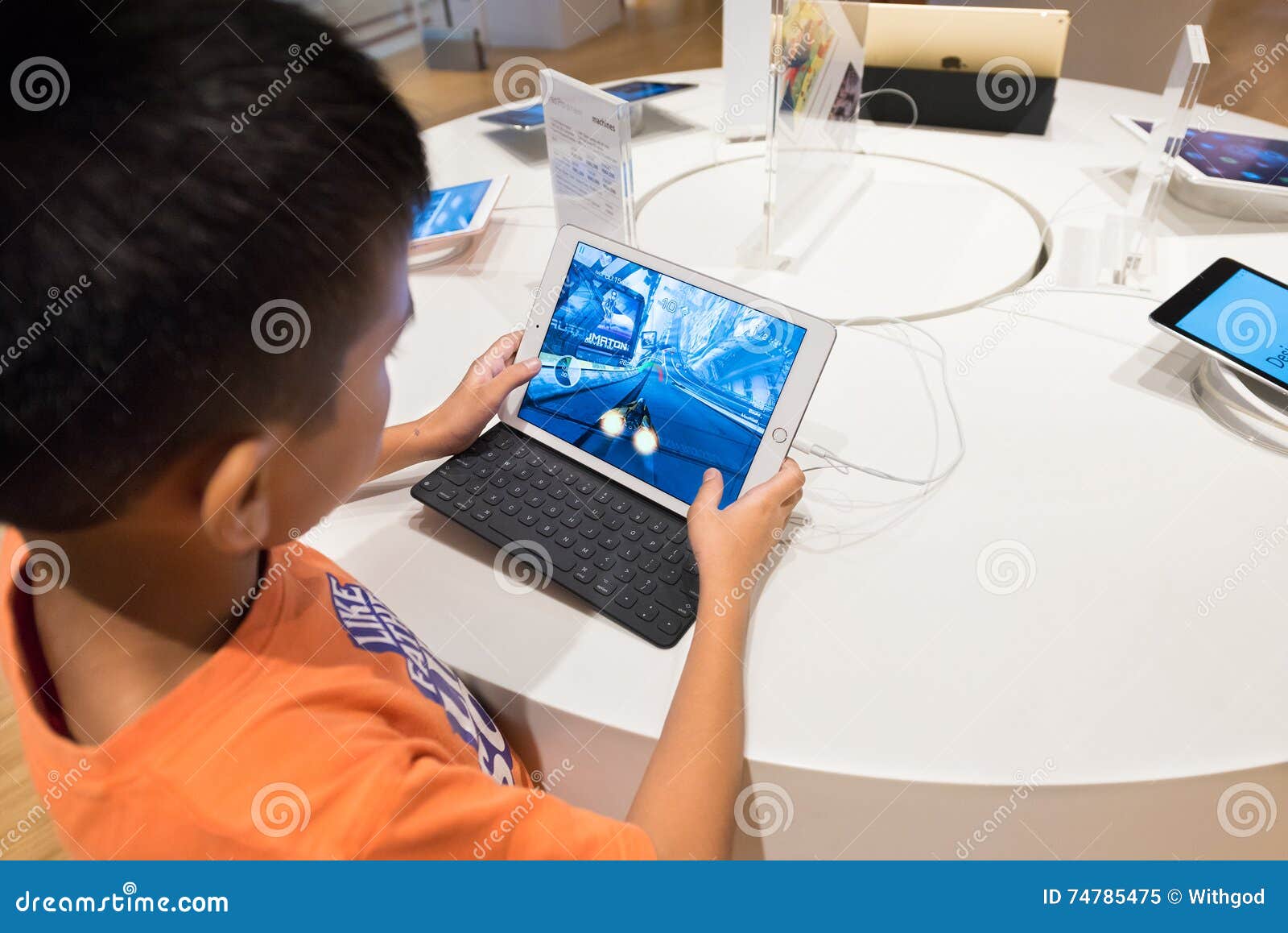 Boy Plays on IPad, Kuala Lumpur Editorial Image - Image of asia