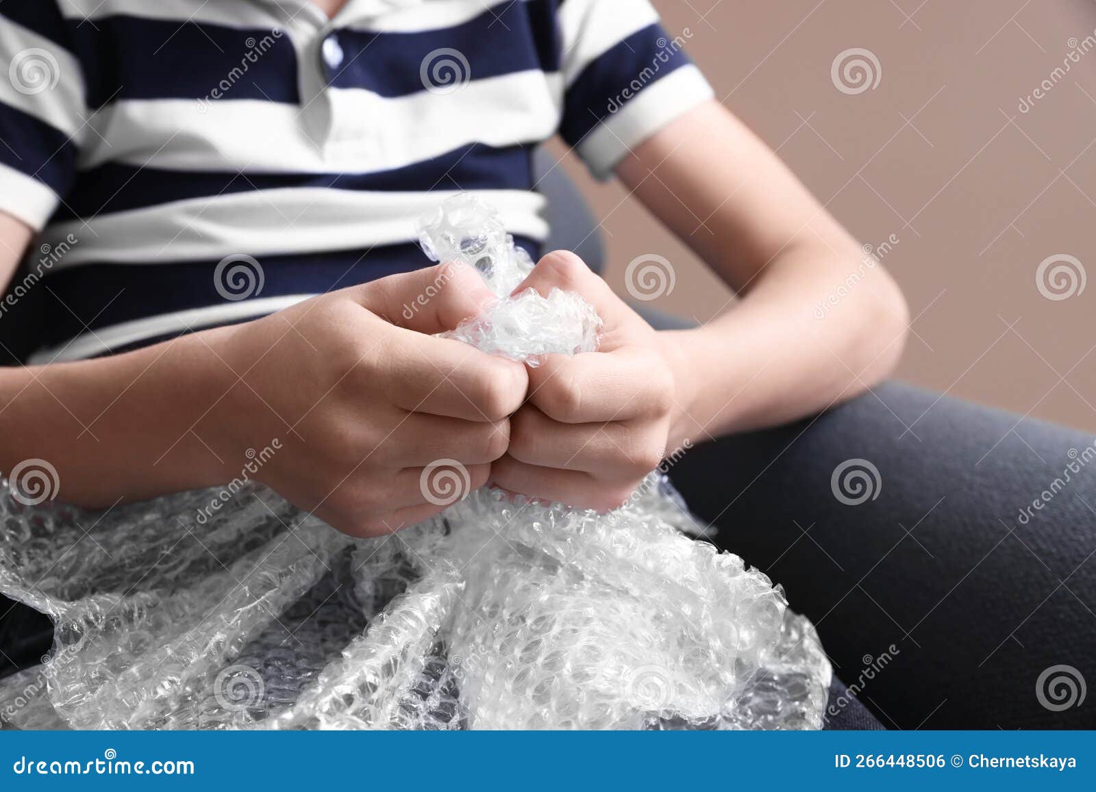 Boy Popping Bubble Wrap, Closeup. Stress Relief Stock Photo - Image of