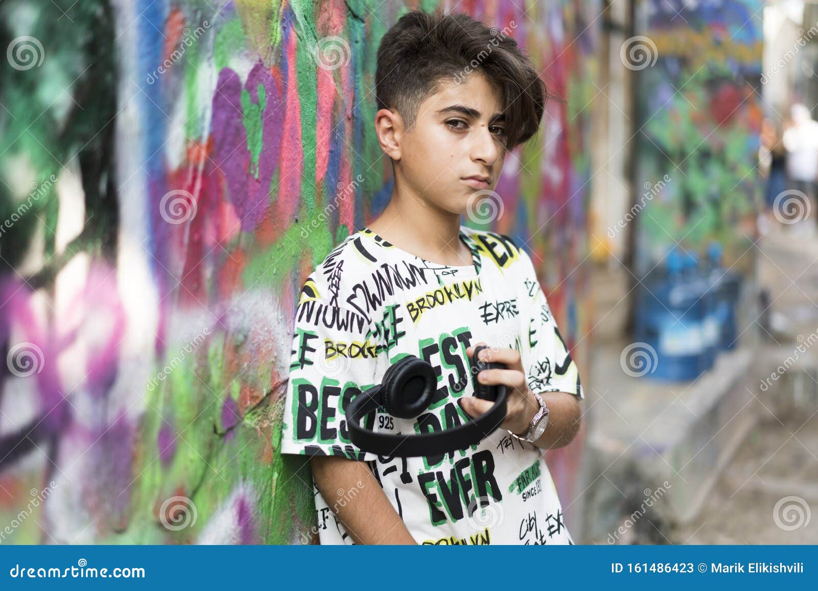 boy portrait with grafiti behind