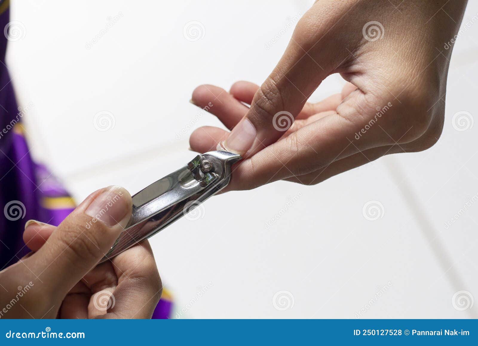 A Boy is Practice To Cut His Nails with Nail Clipper in Order To Keep ...