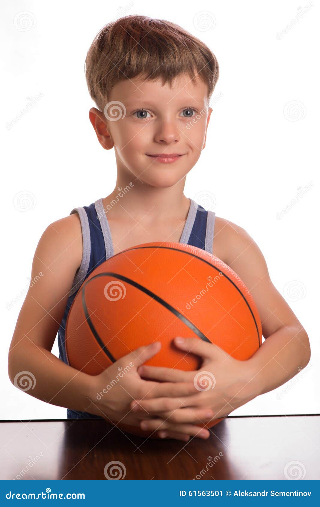 The Boy Pressing A Basketball Ball To A Breast Stock Image pic