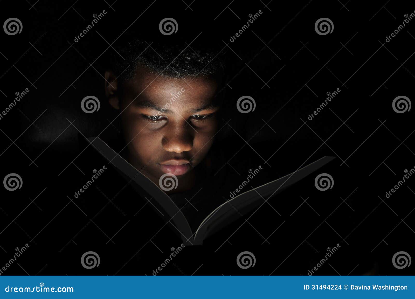 boy reading at night