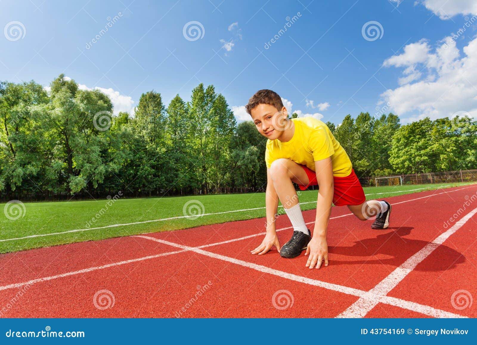 Boy in Ready Position on One Bend Knee To Run Stock Image Image of