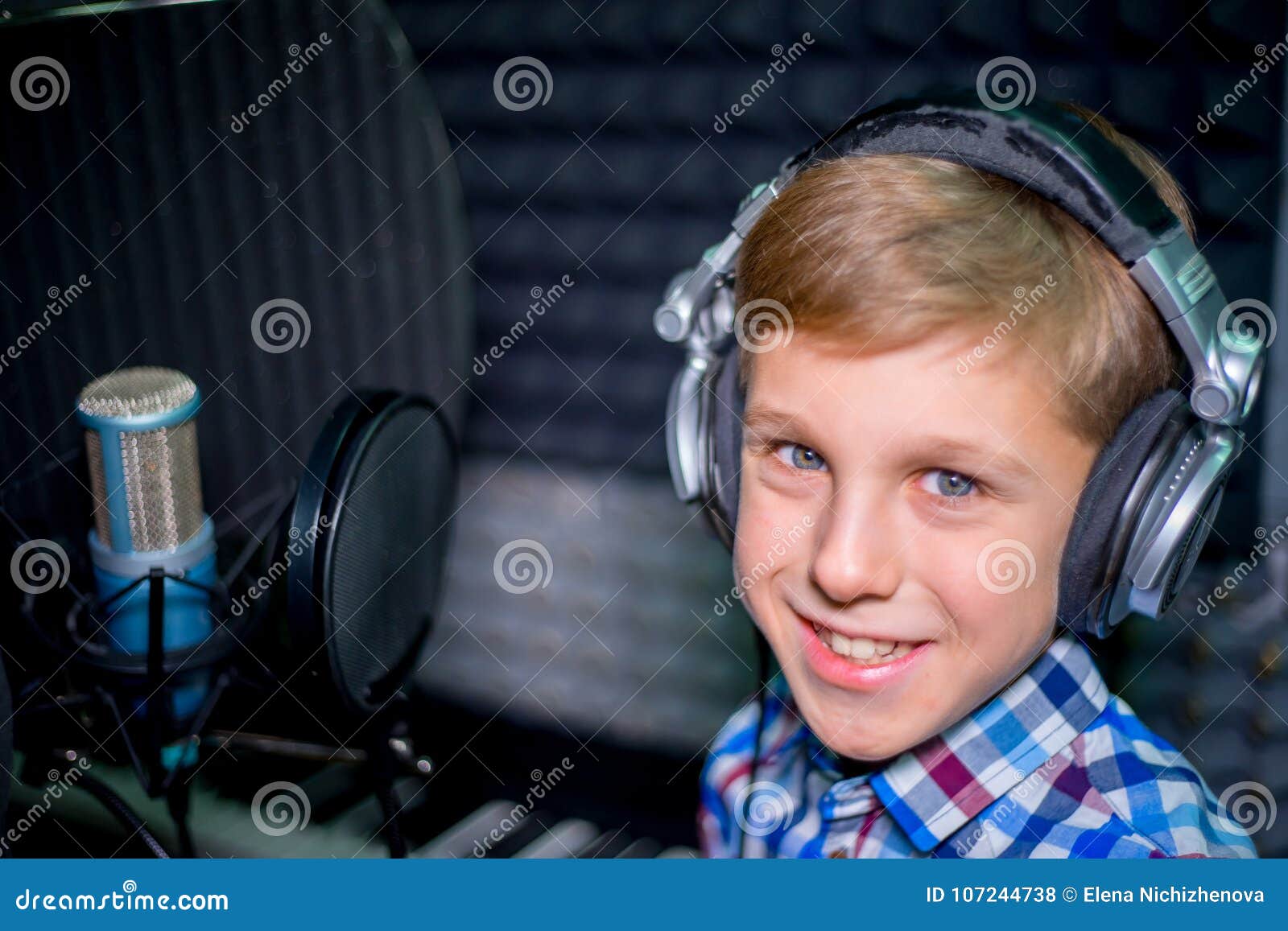 Boy in a recording studio stock photo. Image of board 107244738