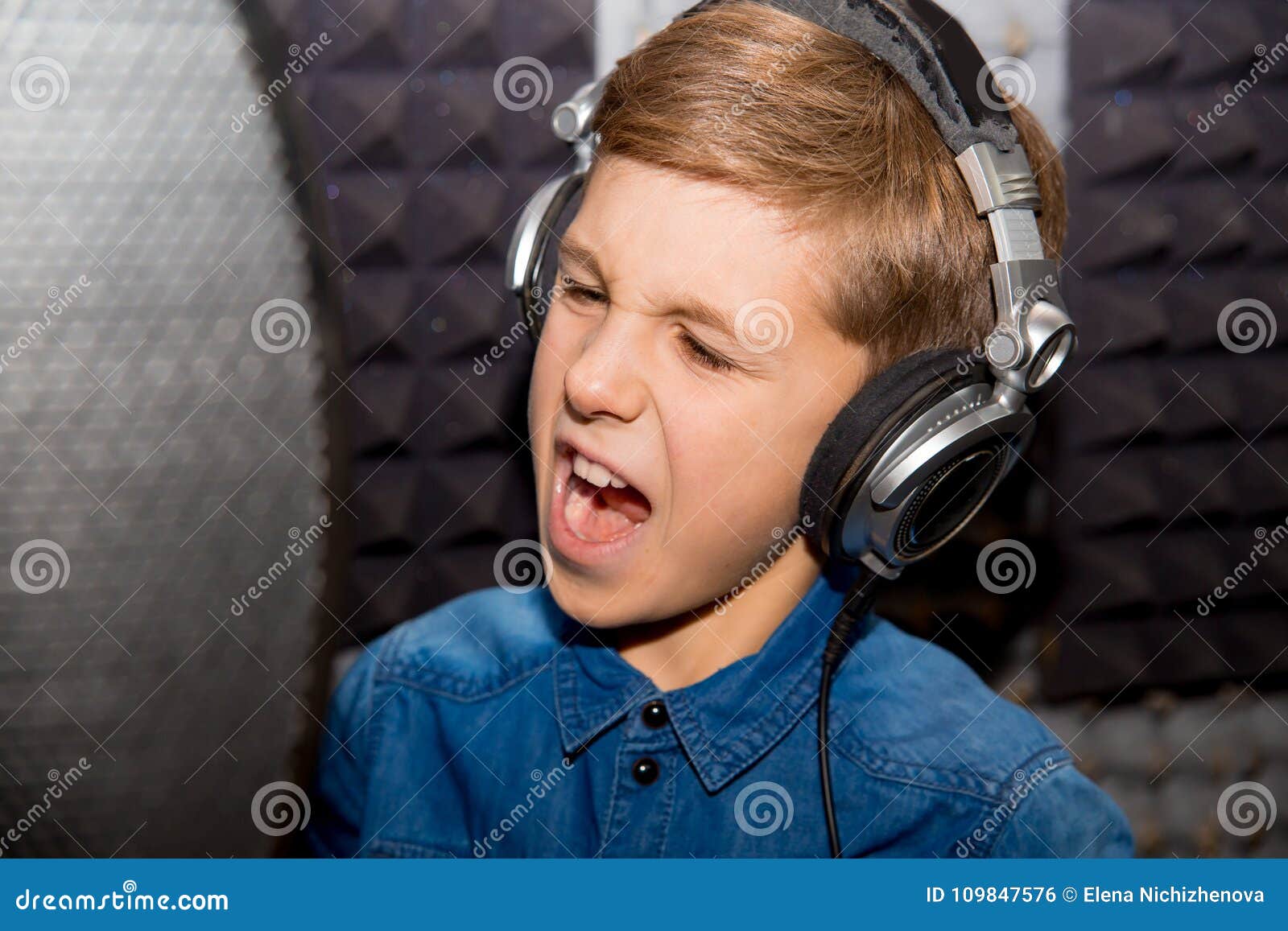 Boy in a recording studio stock photo. Image of concert 109847576