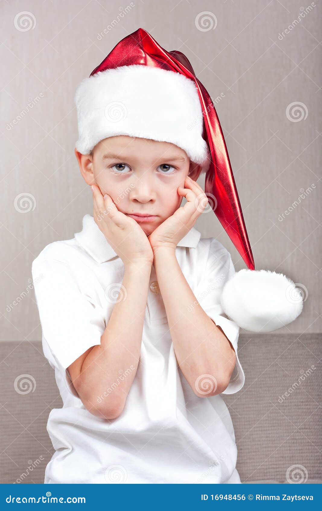 Boy in red christmas hat stock photo. Image of little 16948456