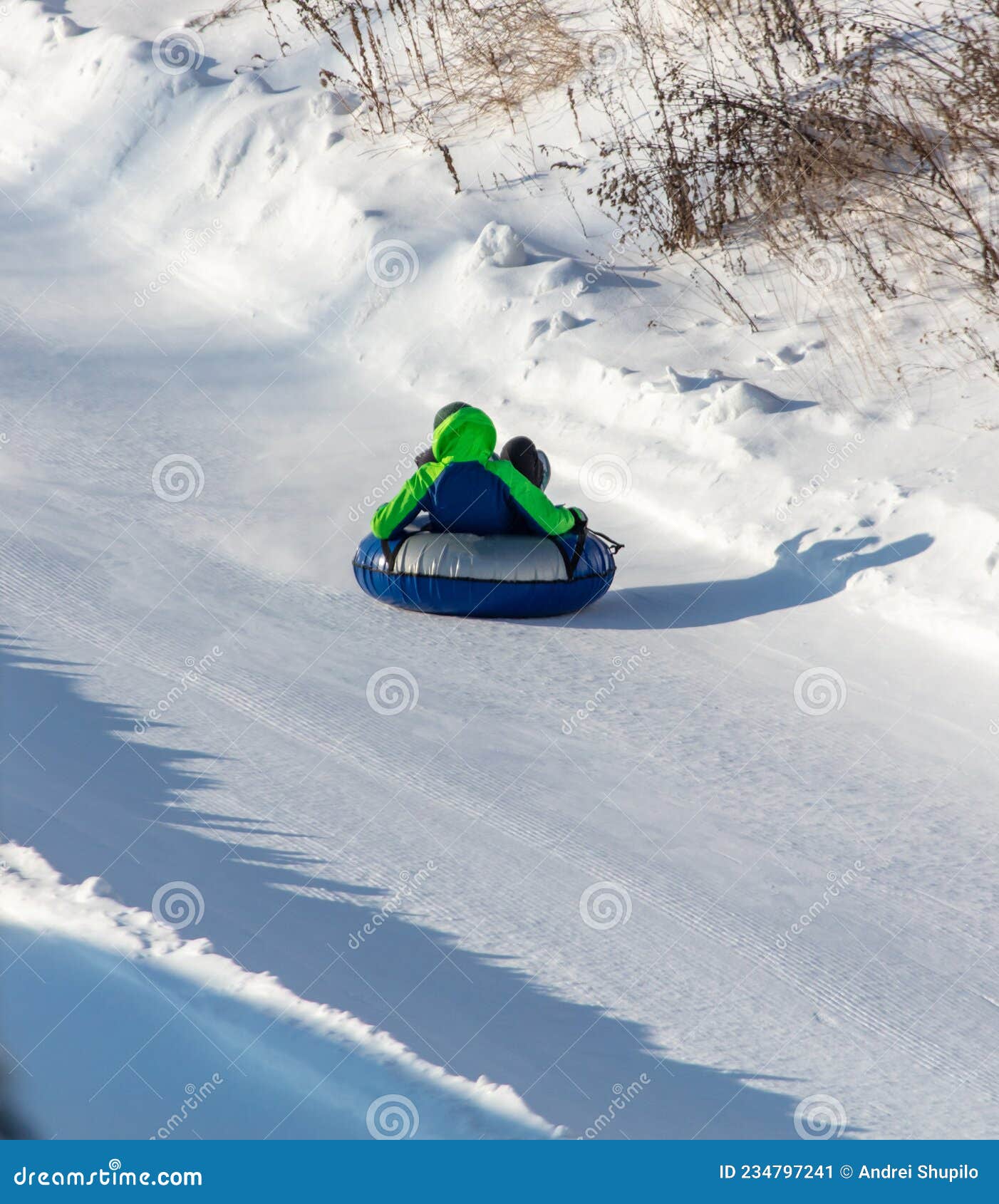The Boy Rolls Down the Mountain on a Tubing Stock Image Image of
