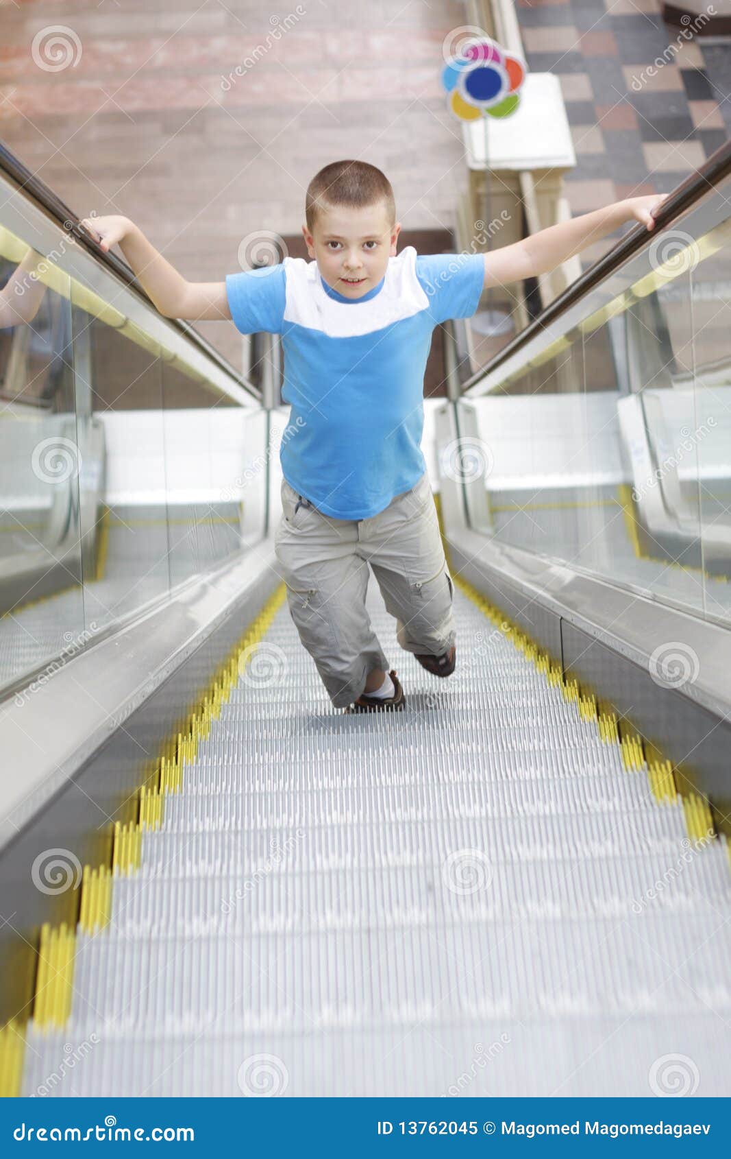 Boy Running Up by Escalator Stock Image Image of person, male 13762045