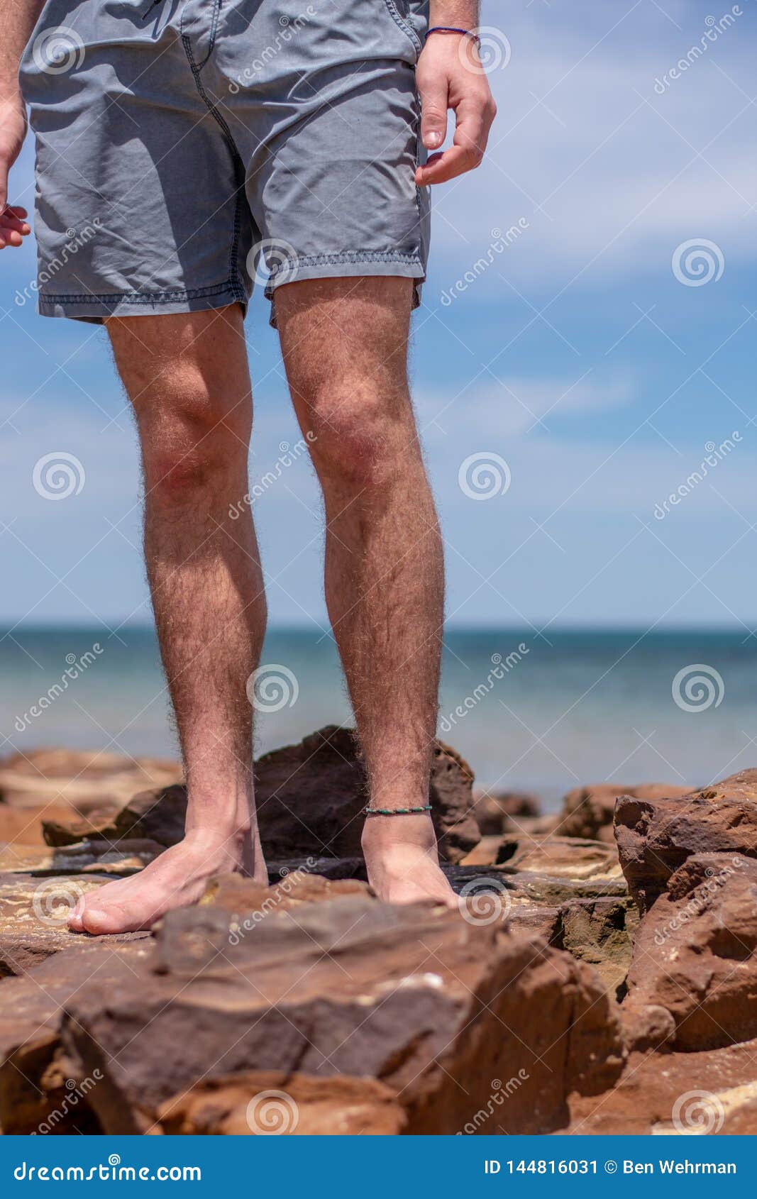 Boy`s Legs on the Beach stock image. Image of young 144816031