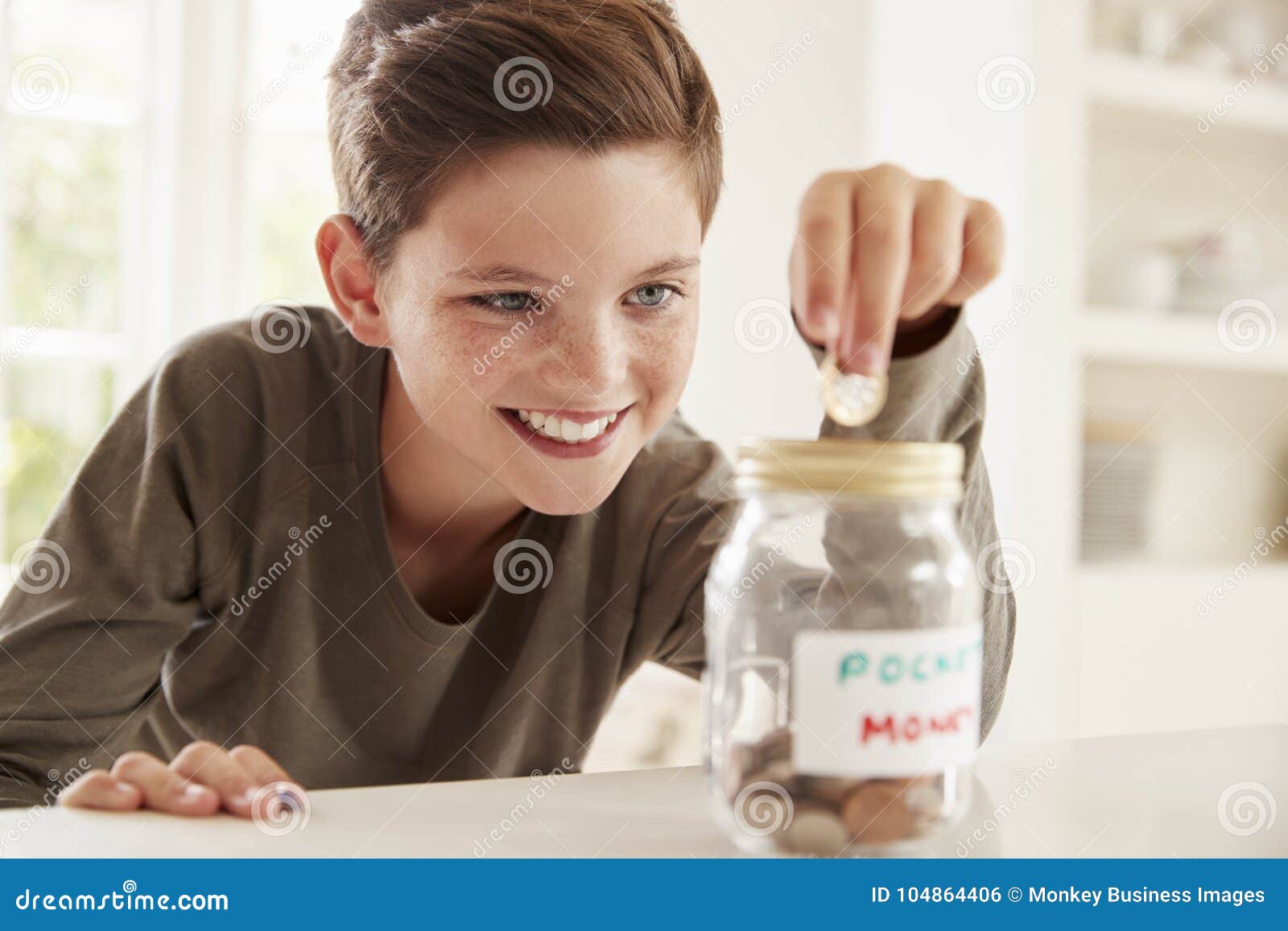 Boy Saving Pocket Money in Glass Jar at Home Stock Photo Image of investing, child 104864406