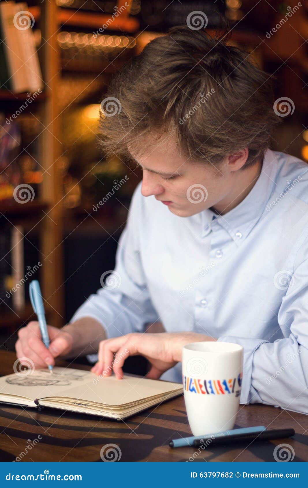 A Boy in Shirt Drawing in the Notebook Stock Photo Image of shirt