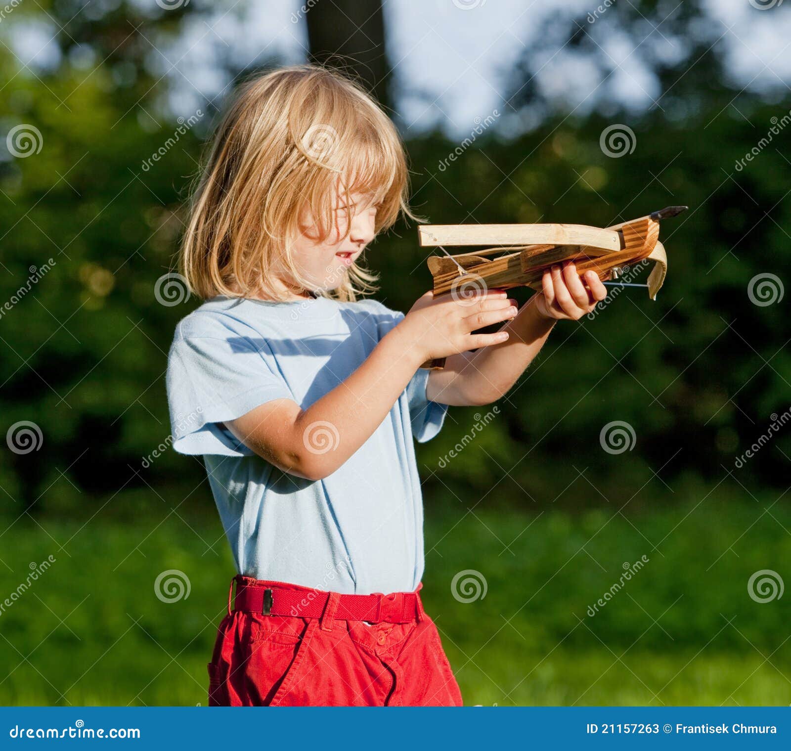 Boy shooting with crossbow stock image. Image of little 21157263