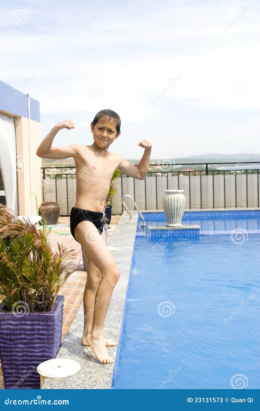 Teenage Boy Flexing Muscles Stock Photo - Download Image Now - Muscular  Build, Swimming Pool, Teenage Boys - iStock