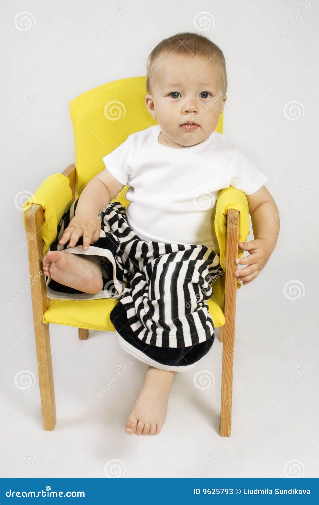 Boy sitting on chair stock image. Image of relaxation - 9625793