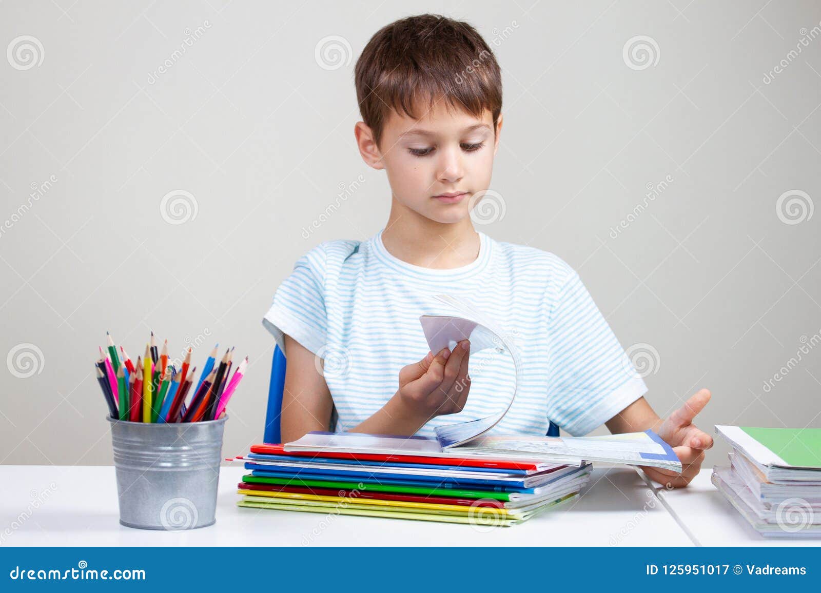 images Boy Sitting At Desk https www dreamstime com boy sitting desk pile school books notebooks doing homework home kid sitting desk pile school image125951017