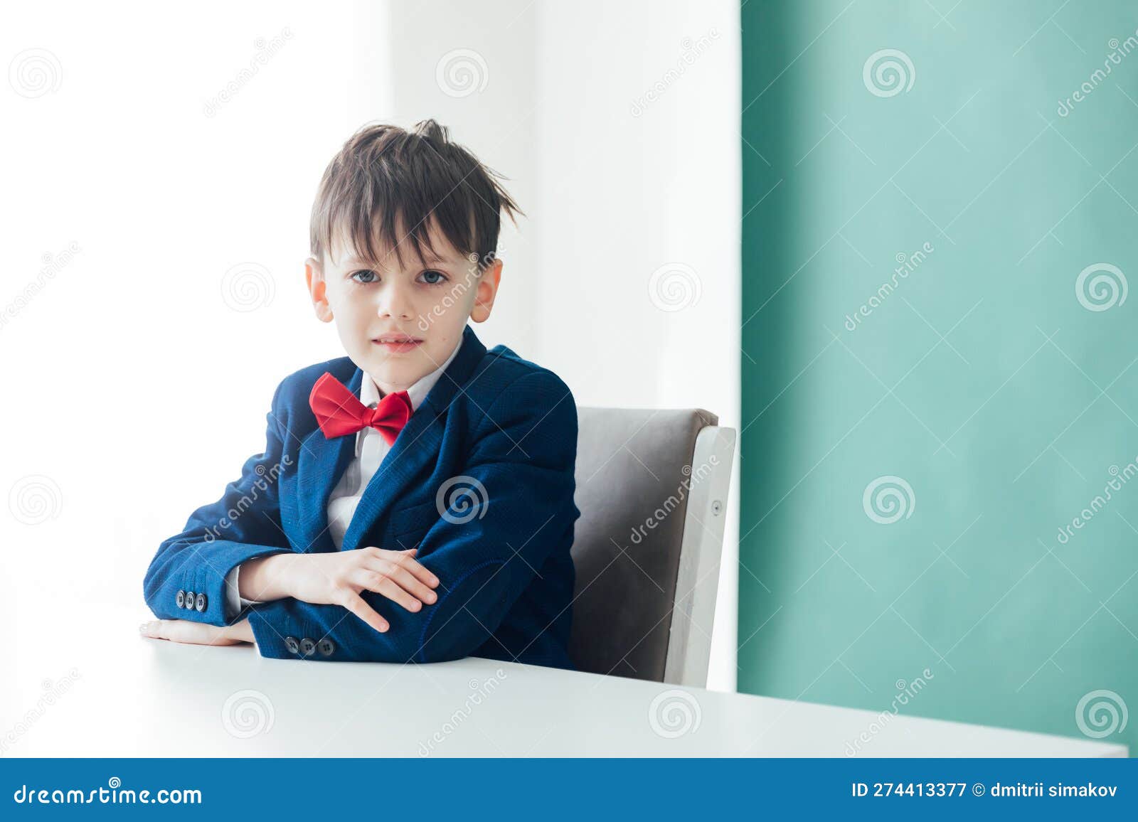 Boy Sitting at a Desk at a School Education Knowledge School Stock