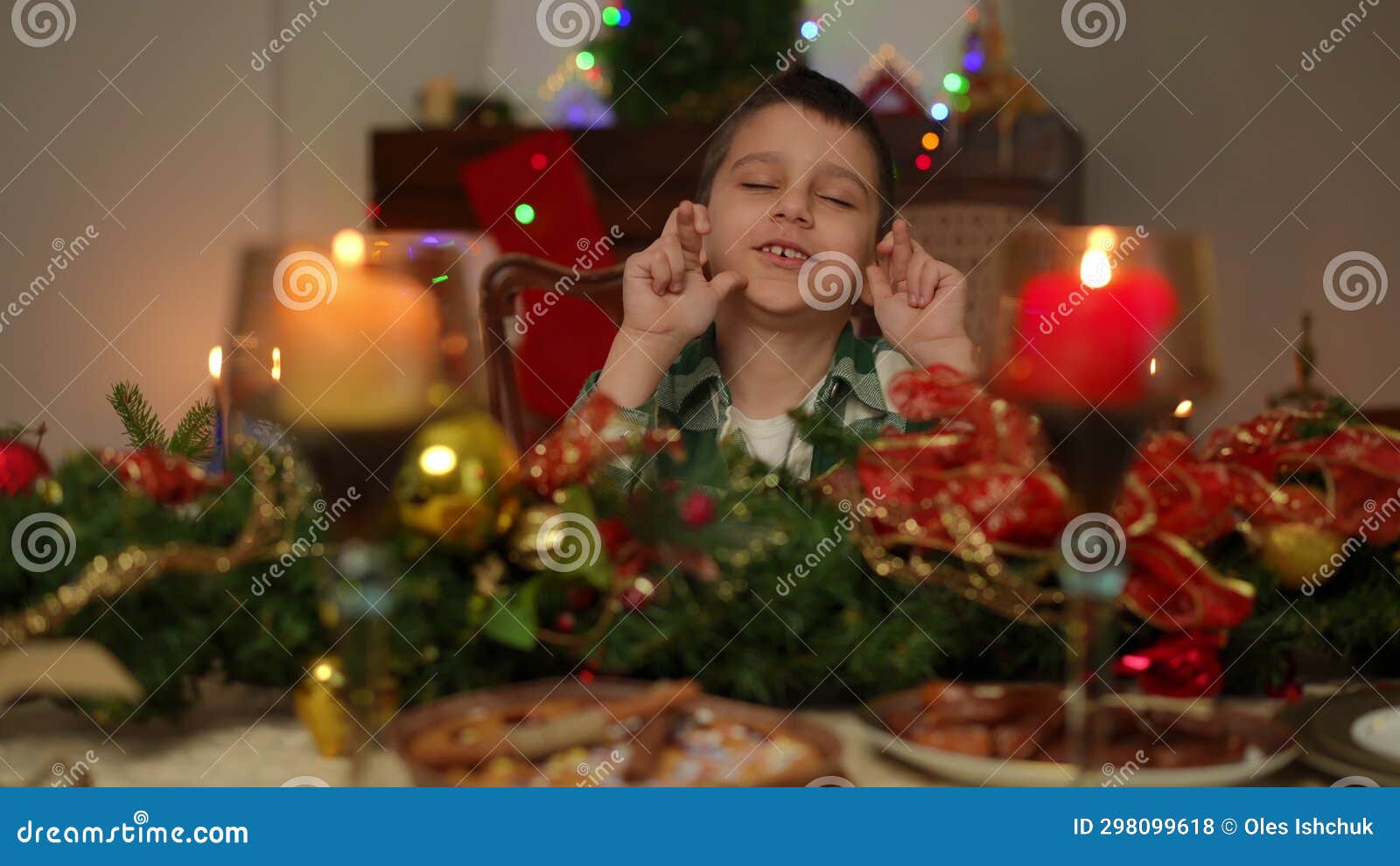 A Boy, Sitting at a Festively Decorated Table for Christmas, Makes ...