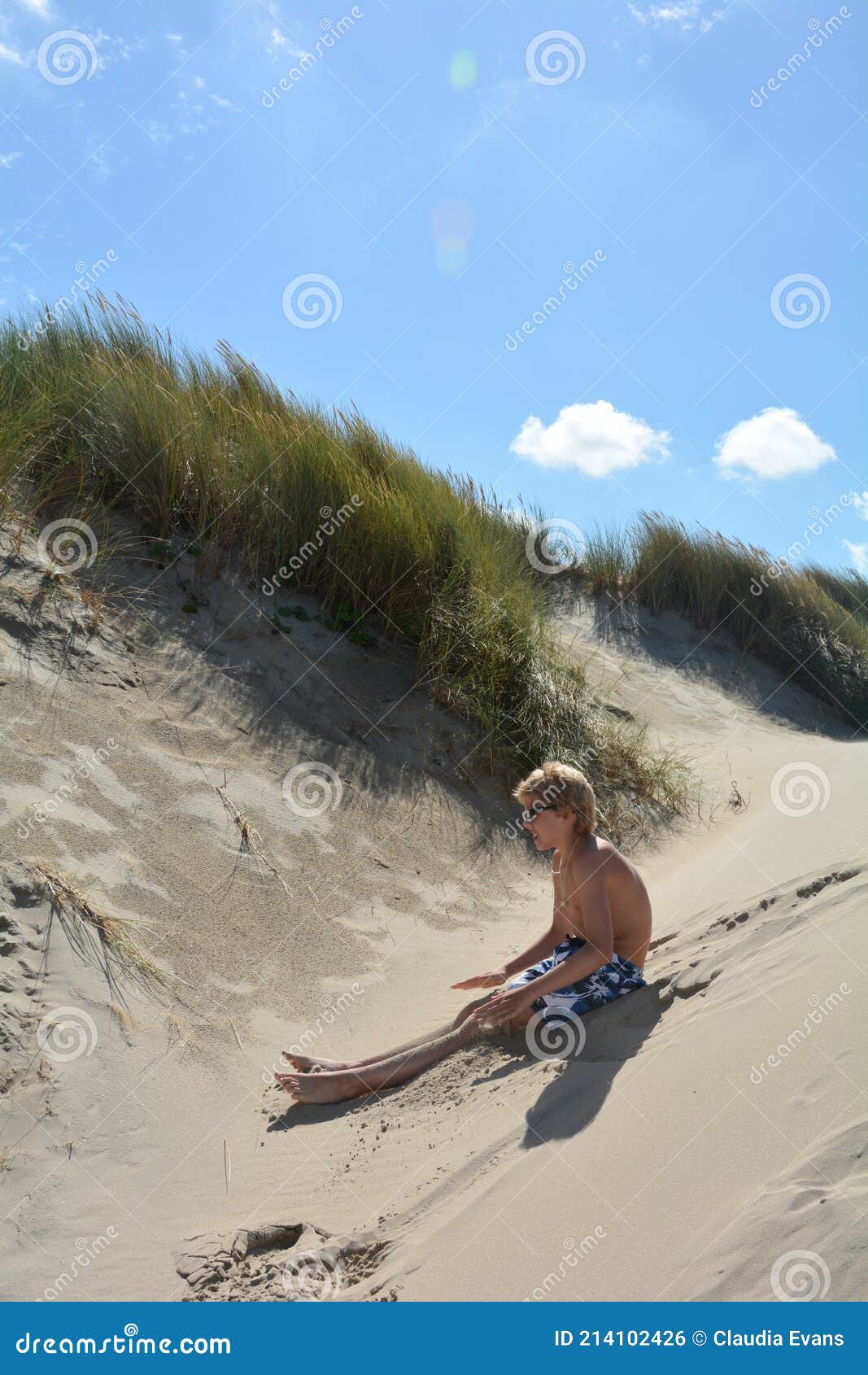 Boy is Sitting in the Sand Dunes in Summer Stock Photo - Image of