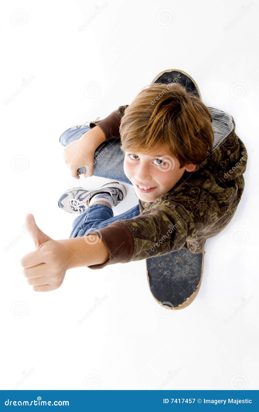 Boy Sitting on Skateboard and Showing Thumbs Up Stock Image Image of