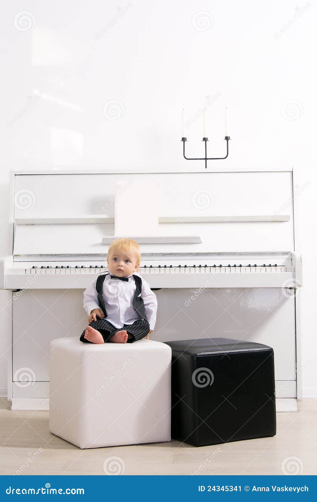 Boy sitting at white piano stock image. Image of little - 24345341