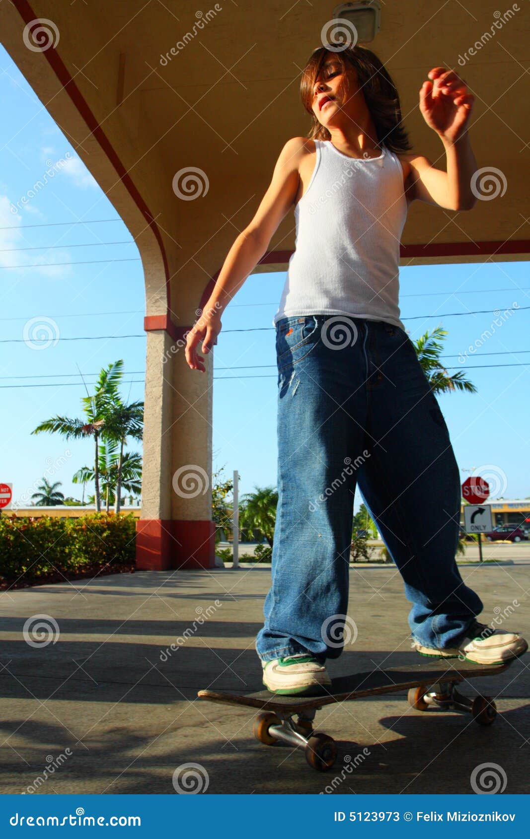 Boy Skateboarding stock image. Image of jeans, shirt, skateboard 5123973