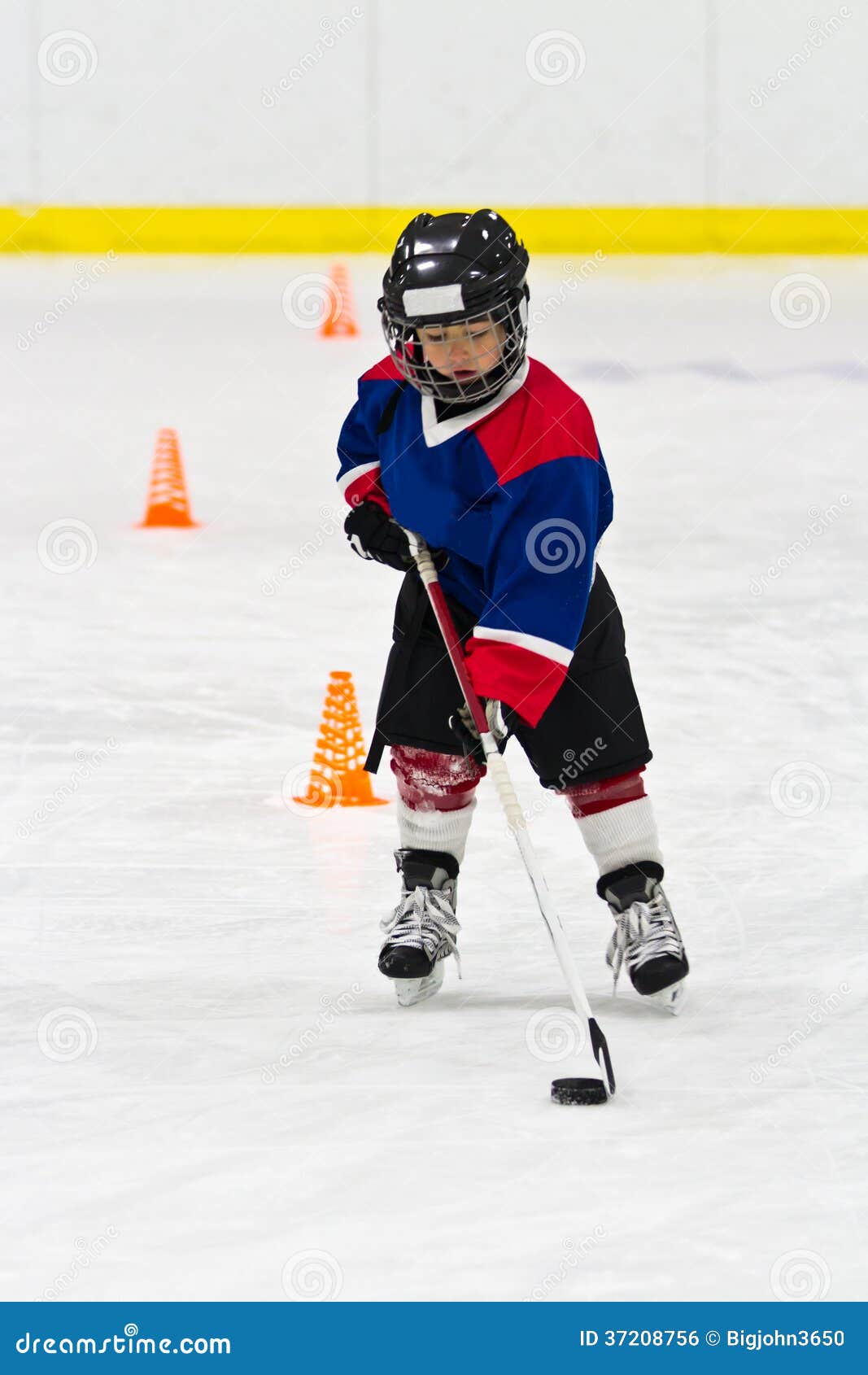 Boy Skating with the Puck at Ice Hockey Practice Stock Photo Image of