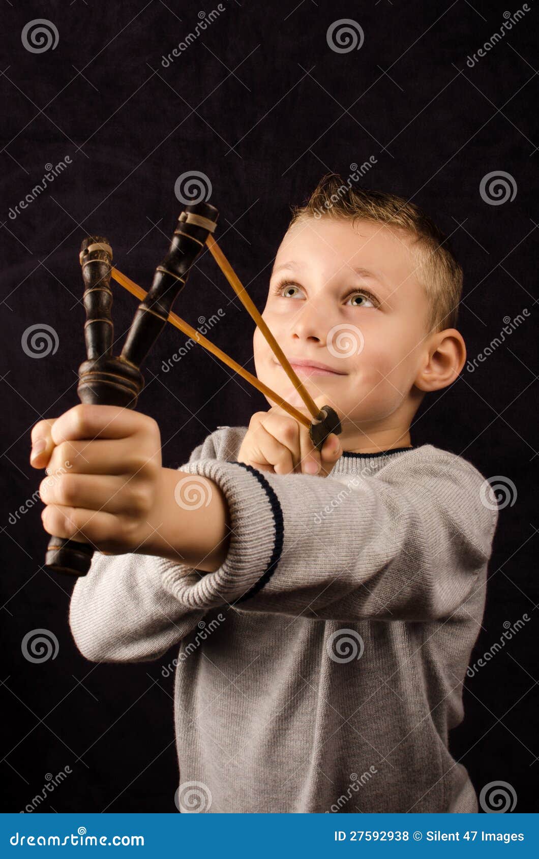 Boy with slingshot stock photo. Image of human, slingshot 27592938