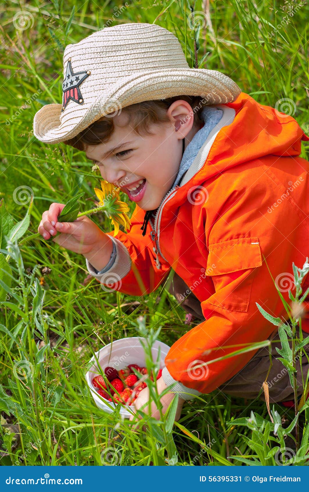 boy smelling the flower with exhilaration