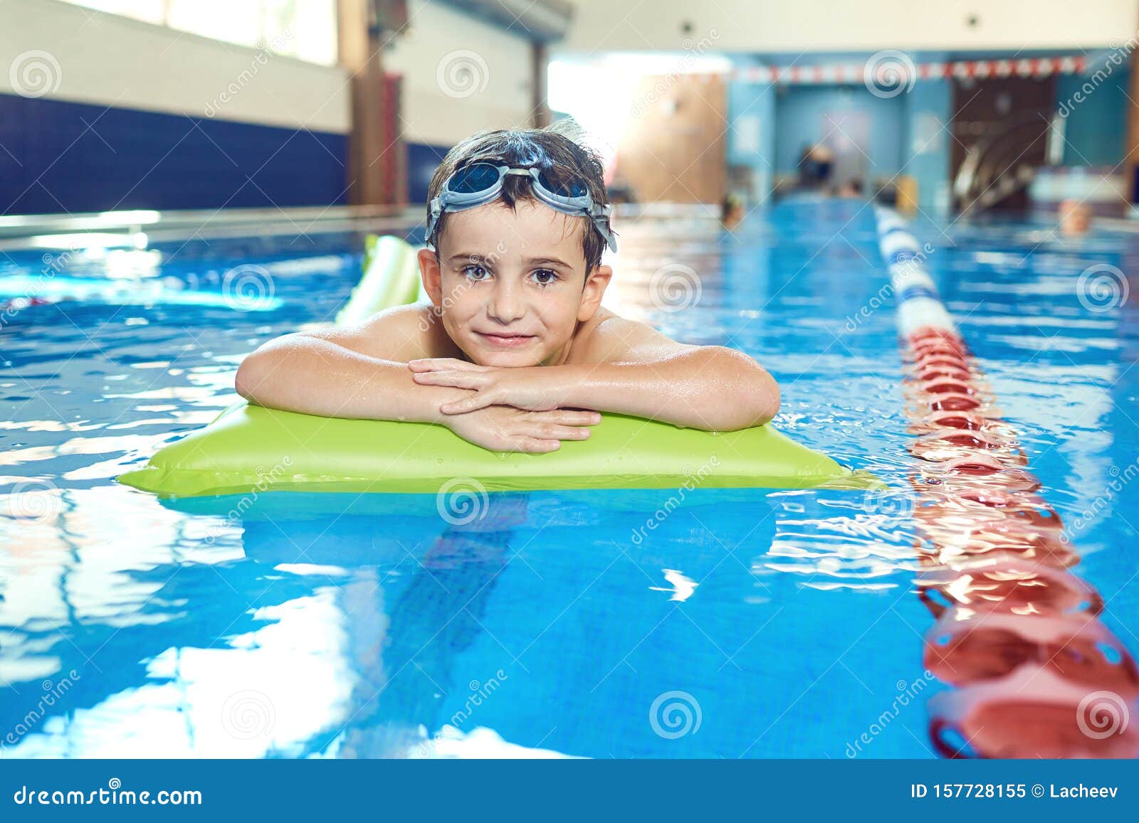 The Boy Smiles in the Swimming Pool. Stock Image Image of pool