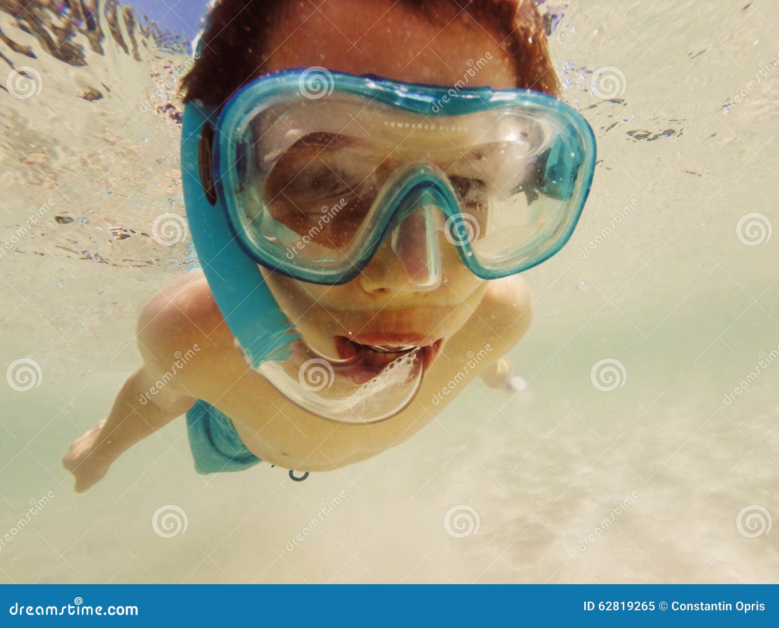 Boy snorkeling stock image. Image of season, water, diver 62819265