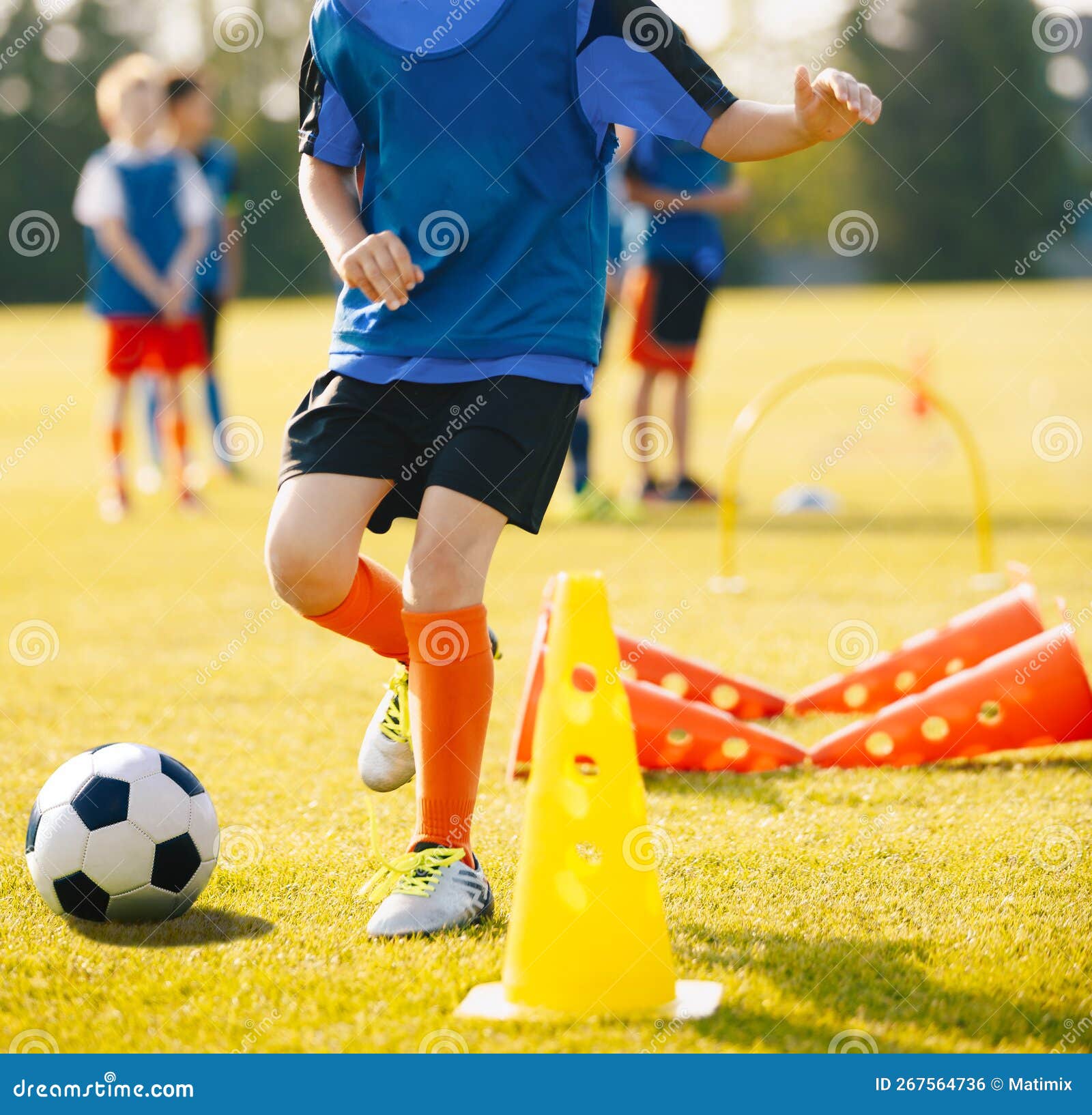 Boy Soccer Player in Training Drill. Young Soccer Players at Practice