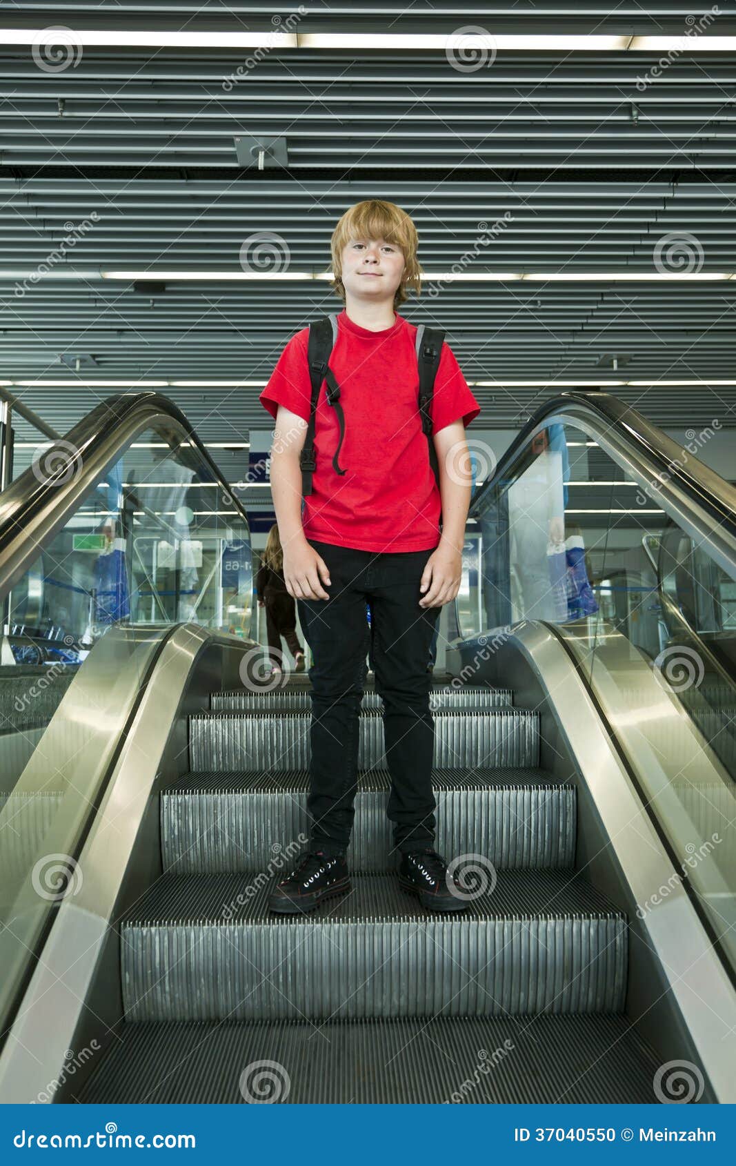 Boy Standing on an Escalator Stock Photo Image of start, airport
