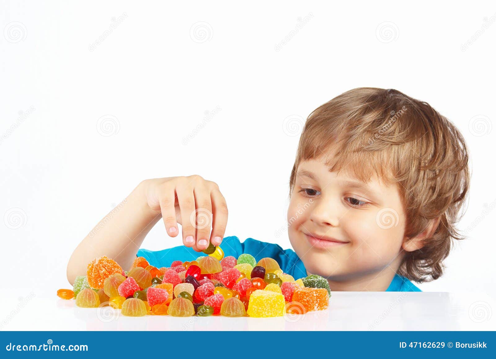 Boy with Sweets and Jelly Candies on White Background Stock Image