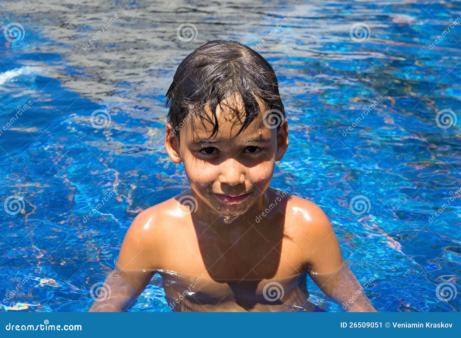 Boy in a swimming pool stock image. Image of relaxing 26509051
